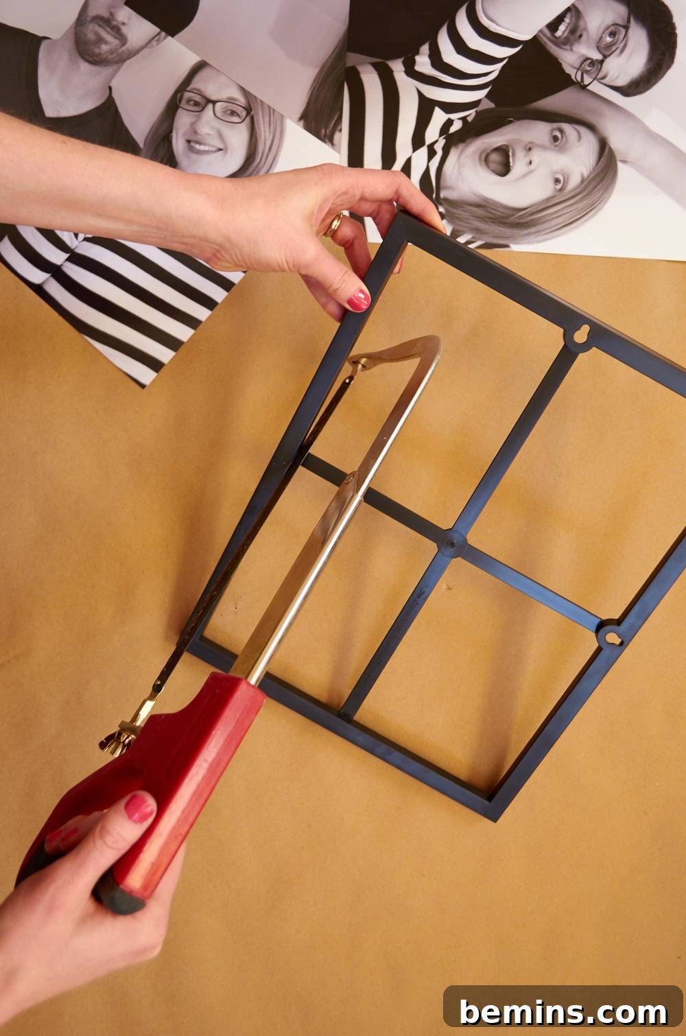 Person fixing a photo in a photo frame