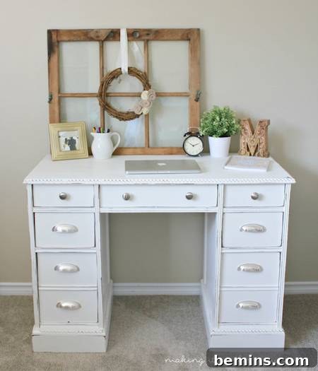 A madeover white desk with items on it.