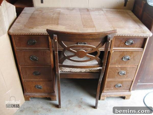 The veneer was removed, leaving a smooth surface, which was painted. It was refinished. Talk about trash to treasure.