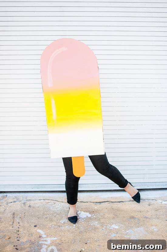 Woman wearing a giant DIY cardboard popsicle costume