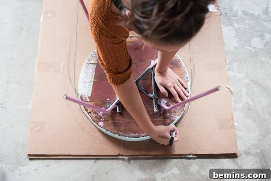 Woman drawing a popsicle shape onto cardboard