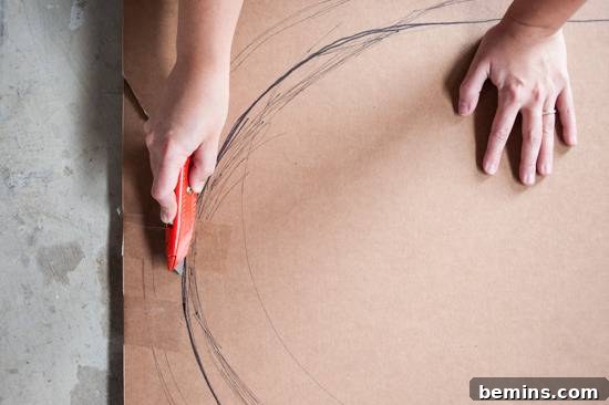 Cutting out the popsicle shape from cardboard