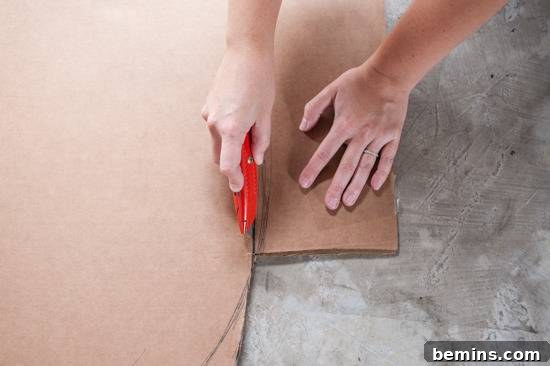 Close-up of cutting cardboard with a utility knife