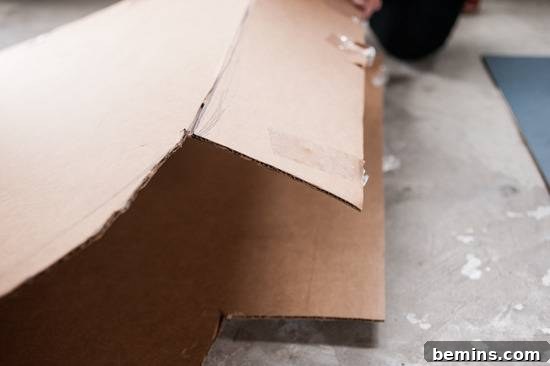 Folding cardboard to create flaps for the popsicle costume