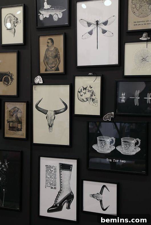 Black wall adorned with framed black and white drawings, creating a quirky and cool focal point.