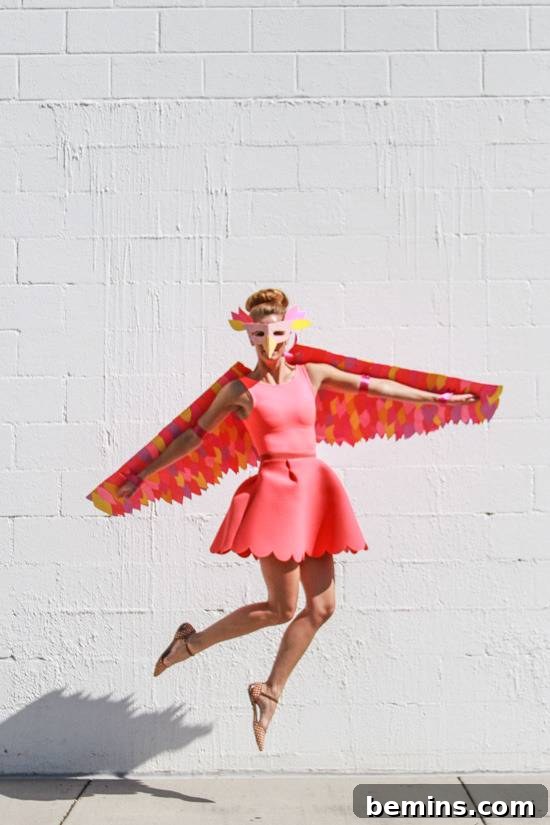 Craft Your Own Bird Costume: A Step-by-Step Guide 2 A woman in a pink dress is jumping off the ground.