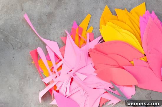 Craft Your Own Bird Costume: A Step-by-Step Guide 7 Various colour cardboard leaves with a Caesar lying on the floor