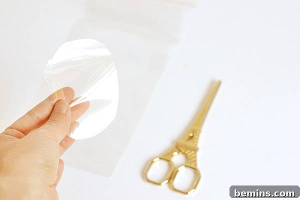 Cutting a cello circle for the Halloween fang treat bag