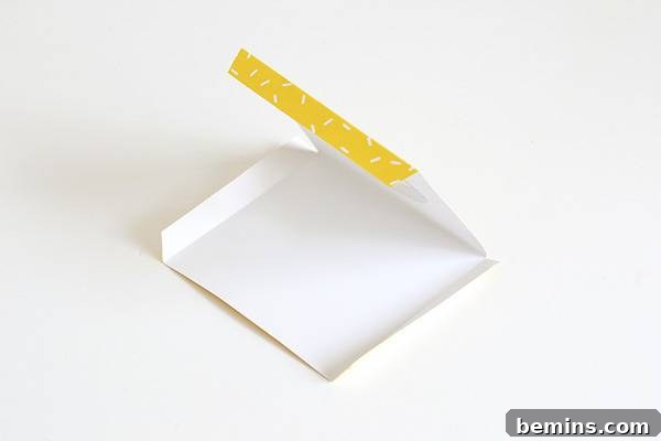 Folding the Halloween fang treat bag