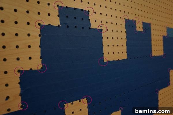 Spooky & Bright: LED Rope Light Halloween Yard Art 5 Drilling holes in the pegboard