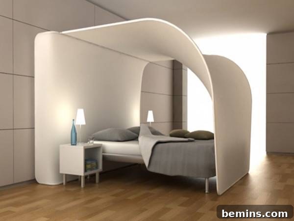 White canopy arching over the top of a bed in a room with a wooden floor.