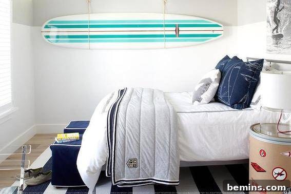 An adult bedroom that looks subtle and simple, showcasing how colorful sports equipment can become art when displayed against a neutral background.
