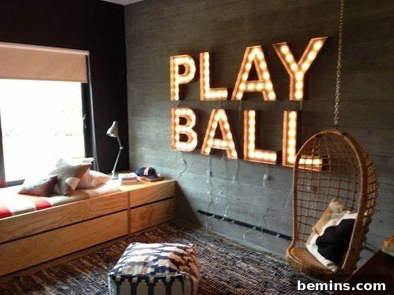 A bedroom with a sofa chair and bed, featuring two sports jersey paintings on the wall, illustrating the use of sports-related phrases as decor.