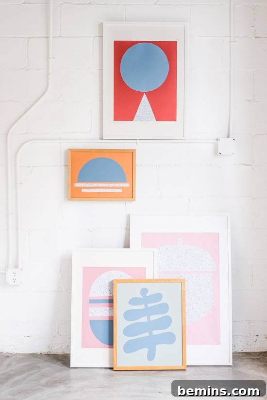 Craft Quick Wall Art: A 30-Minute DIY Project 12 Several pieces of pastel aret are leaning against a wal with two piece of art hanging inbetween white electrical lines and boxes.