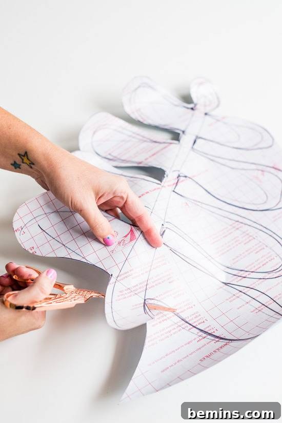 Craft Quick Wall Art: A 30-Minute DIY Project 7 A pair of hands cutting a paper patern.