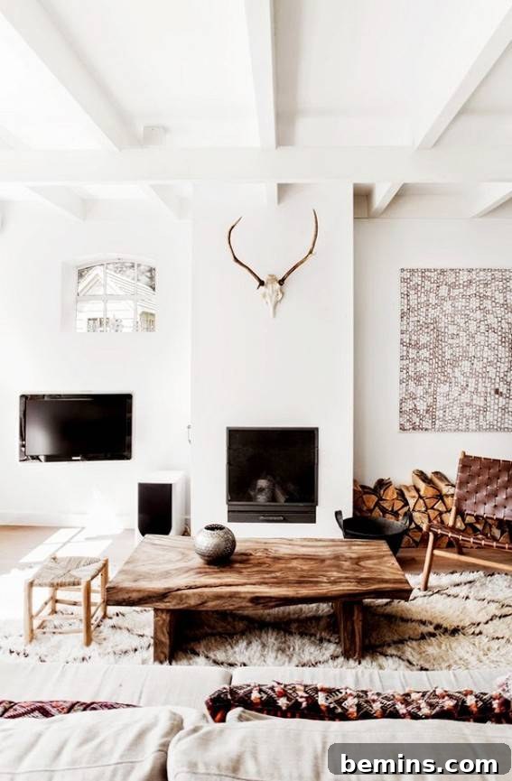 Visual Delight: 10 Modern Yet Cozy Cabins Perfect for a Woodland Escape 10 White furnished room in a cabin, creating a cozy and minimalist aesthetic.