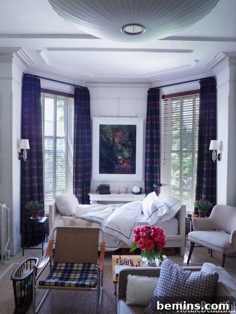 Plaid Power: 10 Rooms Where Tartan Truly Shines 3 A cozy white living room featuring a comfortable couch bed and stylish chairs, perfect for relaxation and entertaining.