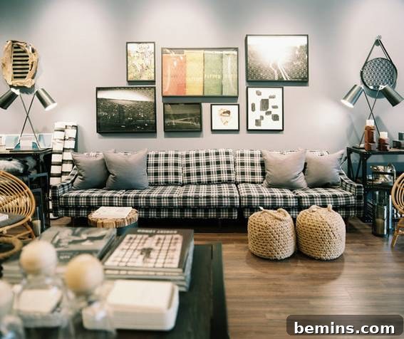Plaid Power: 10 Rooms Where Tartan Truly Shines 5 A long plaid sofa serves as the centerpiece of a room with grey walls, showcasing the pattern's versatility.