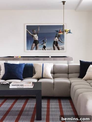 Plaid Power: 10 Rooms Where Tartan Truly Shines 6 A stylish living room featuring a comfortable sofa and an eye-catching wall picture, creating a cozy and inviting atmosphere.