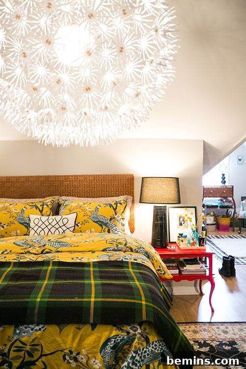 Plaid Power: 10 Rooms Where Tartan Truly Shines 7 A comfortable bed featuring a plaid blanket, showcasing a cozy and stylish bedroom setup.