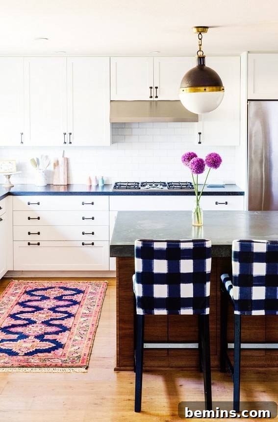 Plaid Power: 10 Rooms Where Tartan Truly Shines 9 Plaid chairs positioned at a kitchen counter, adorned with a purple flower, adding a touch of elegance to the space.