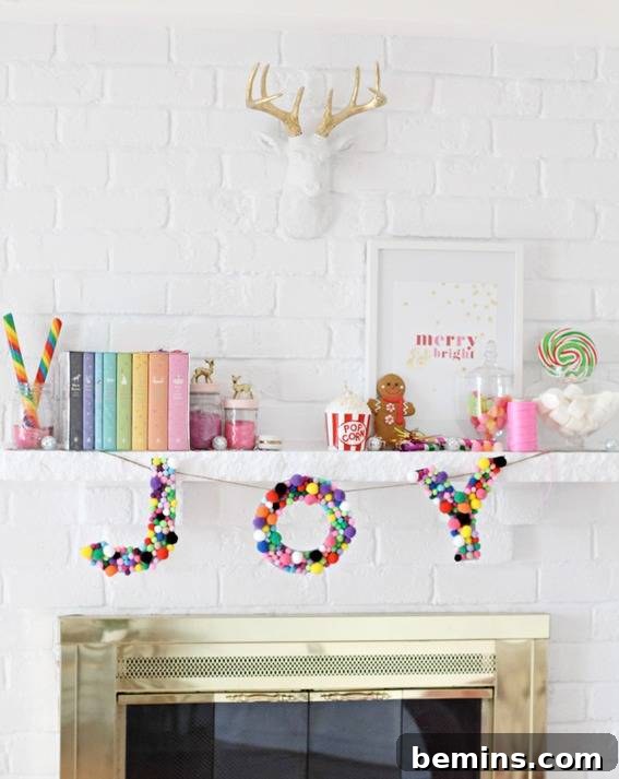 Unconventional Christmas Decor: 11 Fresh Color Palettes 7 Bright colored pom poms used to spell out 'joy' as a garland above a fireplace.
