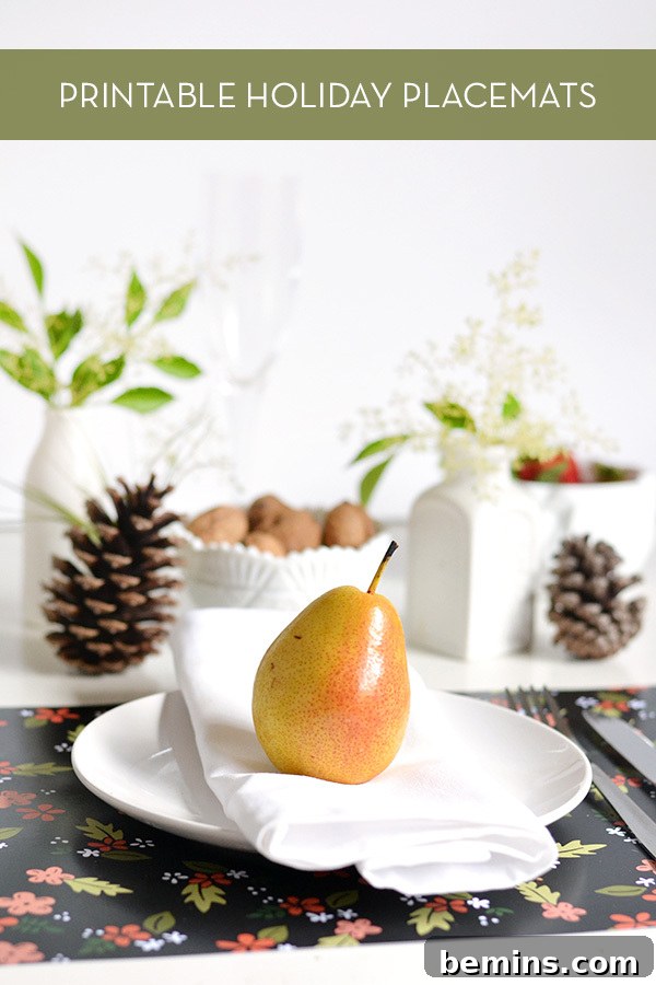 Elegant table setting featuring a pear on a white plate with a folded napkin, accompanied by a pine cone and decorative leaves.