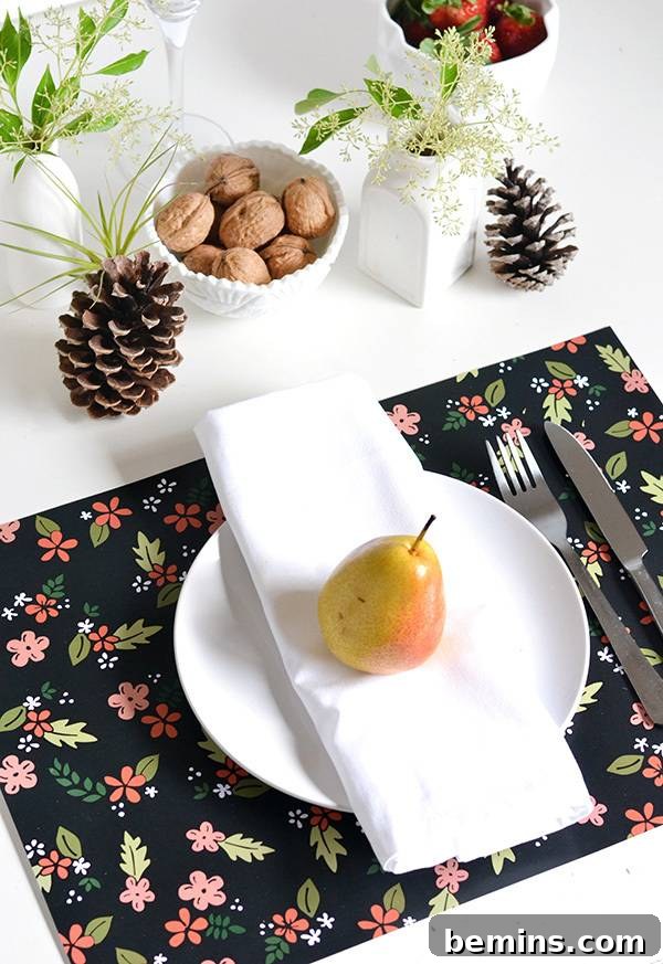 An inviting dining table adorned with fruit, nuts, and colorful placemats, creating a warm and festive atmosphere.