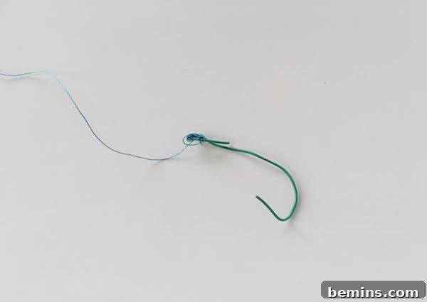 DIY Typographic Christmas Garland: A Festive Craft Project 7 Excess Thread on Christmas Garland