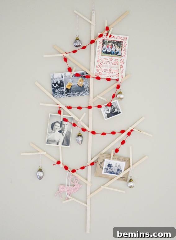 Wooden wall-mounted Christmas tree decorated with family photos