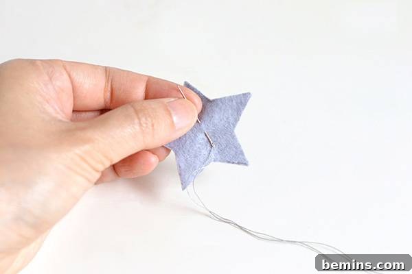 Close-up of Assembling a Felt Star and Moon Garland