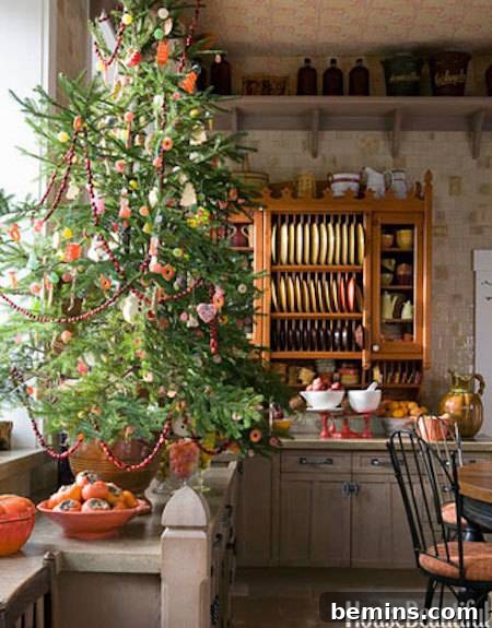 Christmas kitchen with a small, decorated Christmas tree
