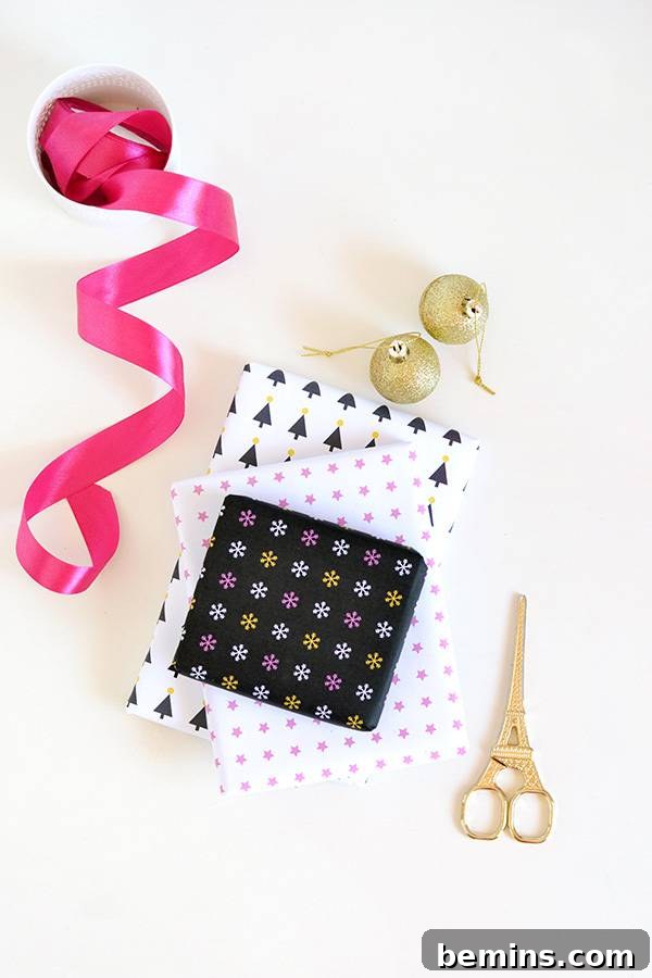 Colorful paper with scissors & pink ribbon next to it for wrapping gifts