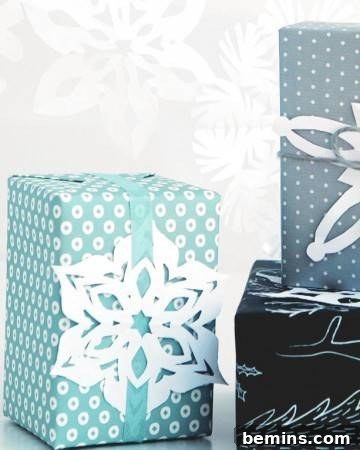 Gift boxes elegantly decorated with delicate paper snowflakes.