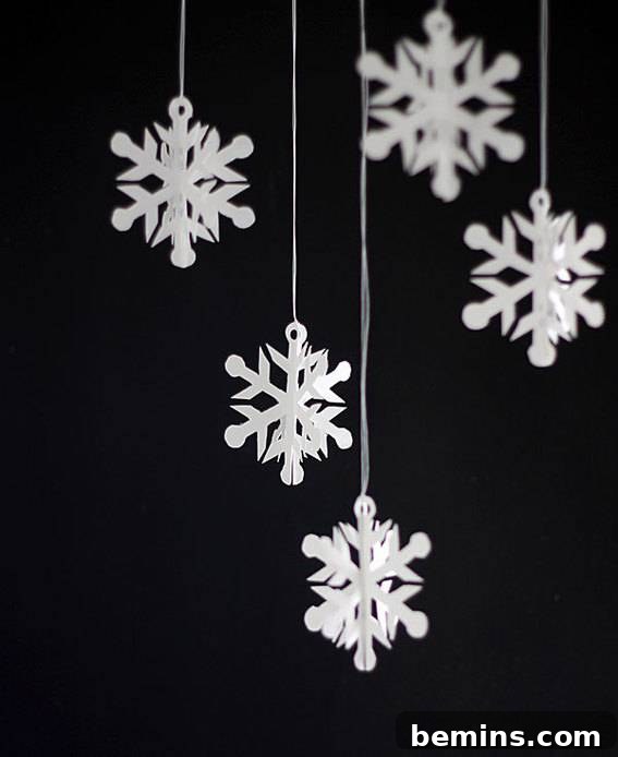 A charming display of decorated hanging snowflakes, creating a festive atmosphere.