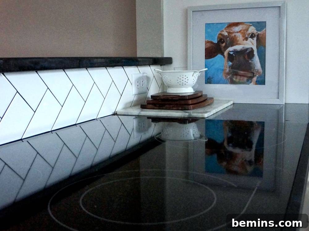 From Retro to Modern: A Kitchen Transformation 8 Herringbone Tile Installation in a 1960s Kitchen Remodel