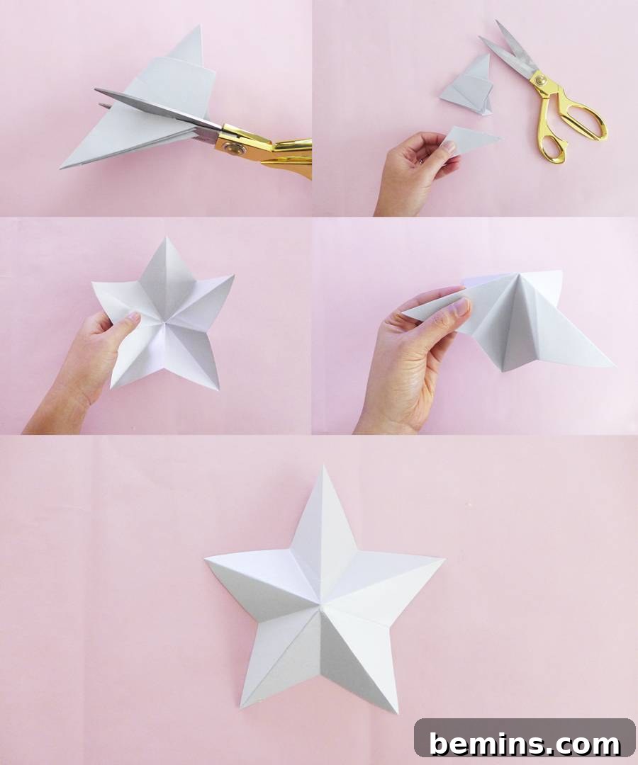 Completed origami star garland hanging on a wall
