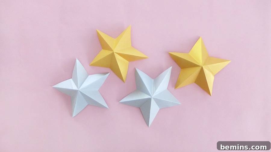 Silver and gold origami stars ready for garland creation