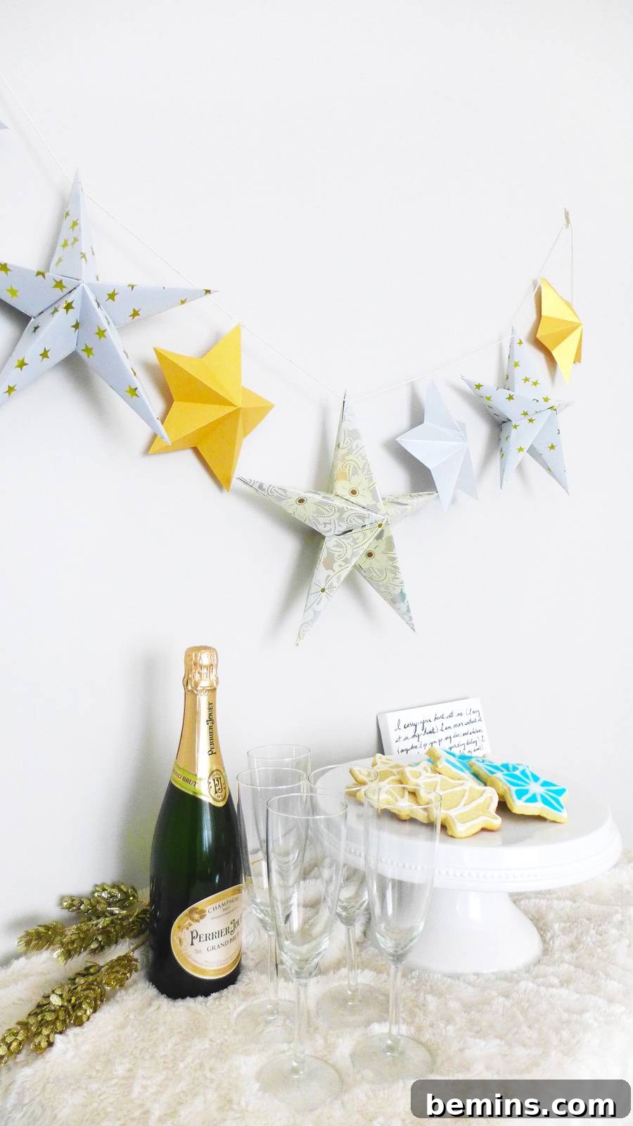Handmade paper star garland hanging on a wall