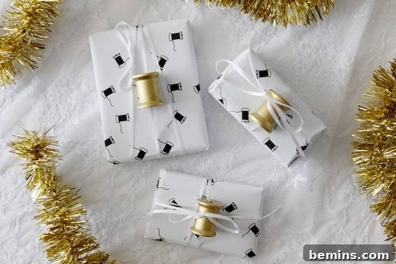 Elegant white printable gift wraps featuring intricate sewing-themed patterns, neatly arranged on a pristine white fabric background.