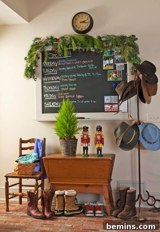 A charming entryway featuring greenery atop a chalkboard, reminding you to stay cheery even amidst the holiday rush.