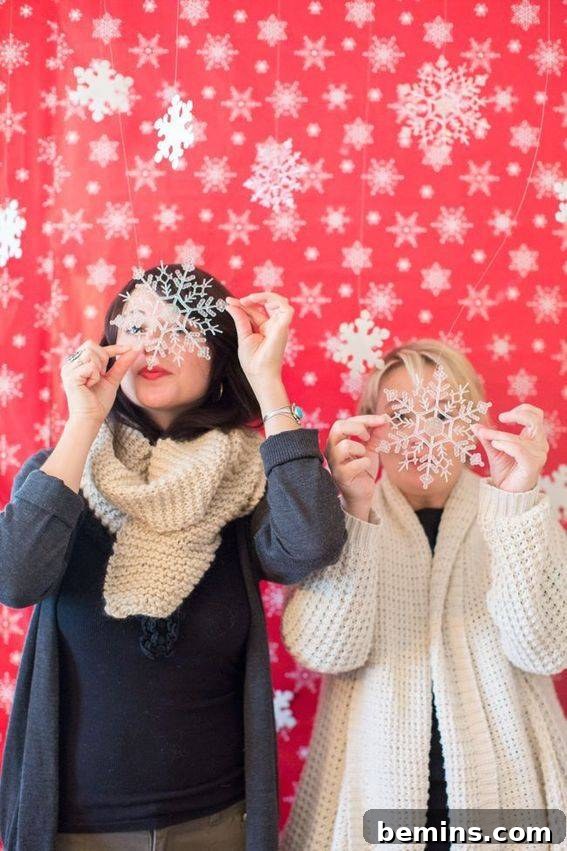 Two women in a snow scene - DIY Winter Wonderland Photo Booth