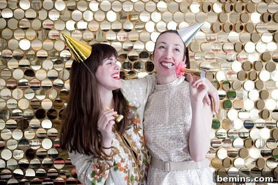Friends enjoying time together in front of sequin backdrop - DIY Holiday Photo Backdrop