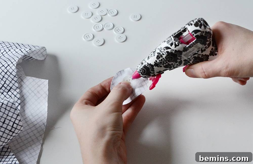 Wrapping the fabric buttons with hot glue