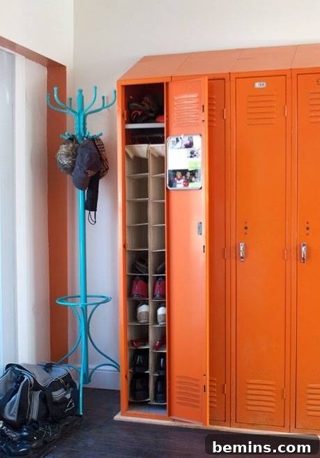 Orange lockers in a mudroom.