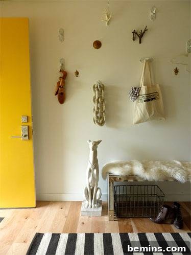 Different types of wall decors and dog statue are inside the room.