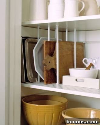 Built-in plate and bowl slots for optimized kitchen cabinet organization.