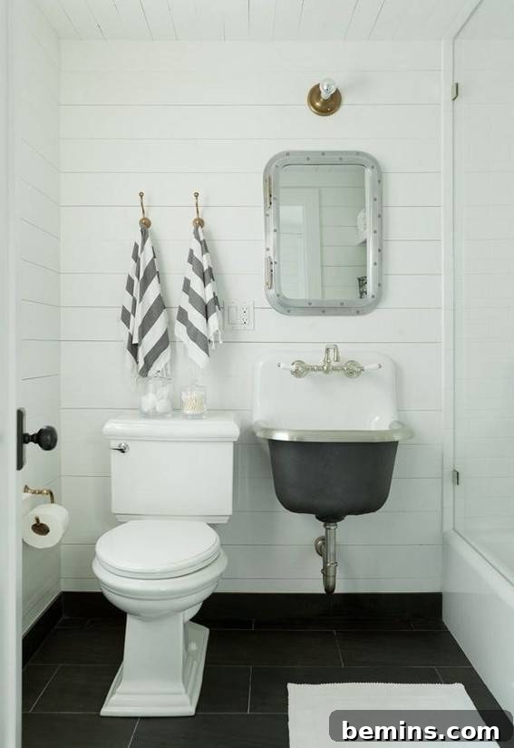A small bathroom with a medicine cabinet and seated vanity in the bedroom.