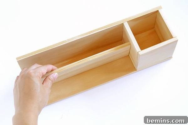 Minimalist Wooden Desk Organizer: A DIY Guide 11 Inserting the middle divider into the DIY desk organizer