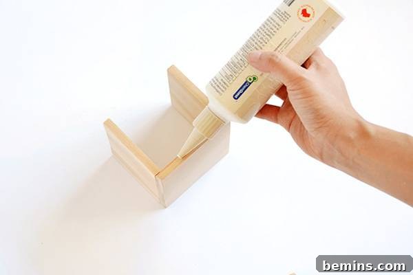 Minimalist Wooden Desk Organizer: A DIY Guide 8 Applying glue to the bottom edge of the pencil holder